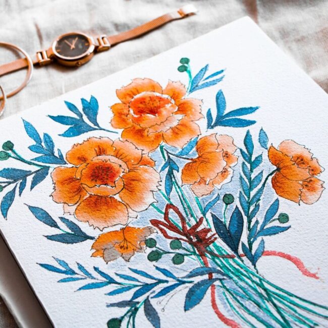 Floral painting with watch and bracelet nearby.