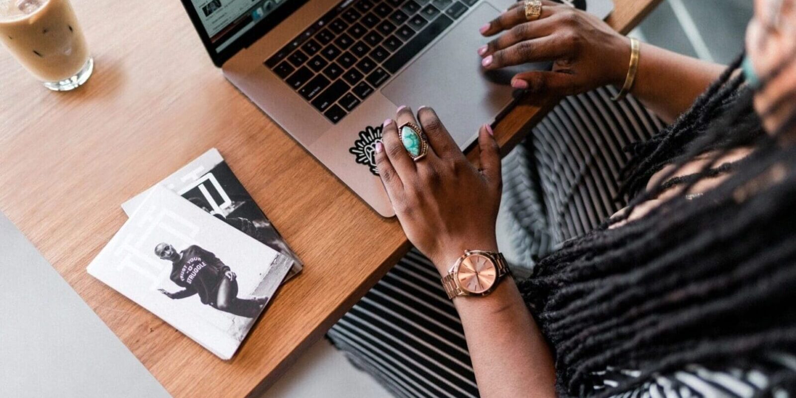 A person sitting at a table with a laptop