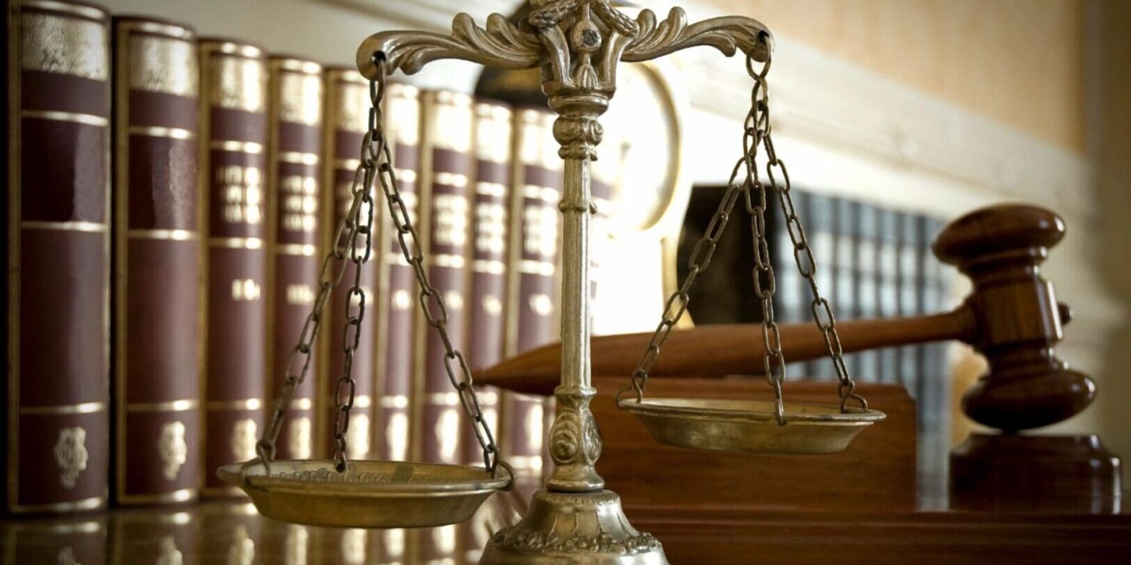 A close up of the scales of justice on top of a table